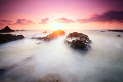 Scenic view of sea against sky during sunset