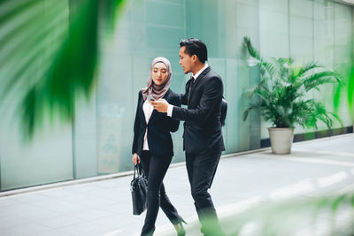 Young couple looking at camera