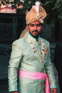 Portrait of young man standing outdoors