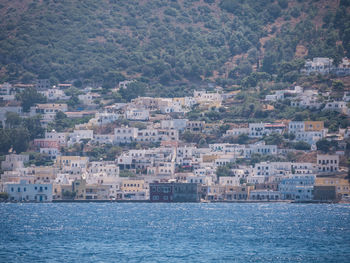 Aerial view of townscape by sea