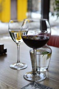 Close-up of wine glasses on table