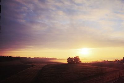 Scenic view of sunset over land