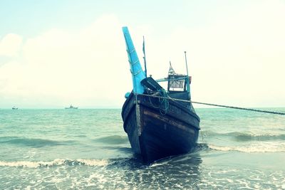 Ship in sea against sky