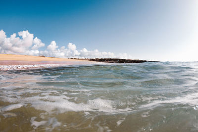 Scenic view of beach against sky