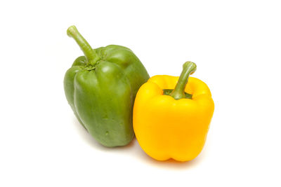Close-up of bell peppers against white background