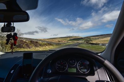 Road seen through car windshield