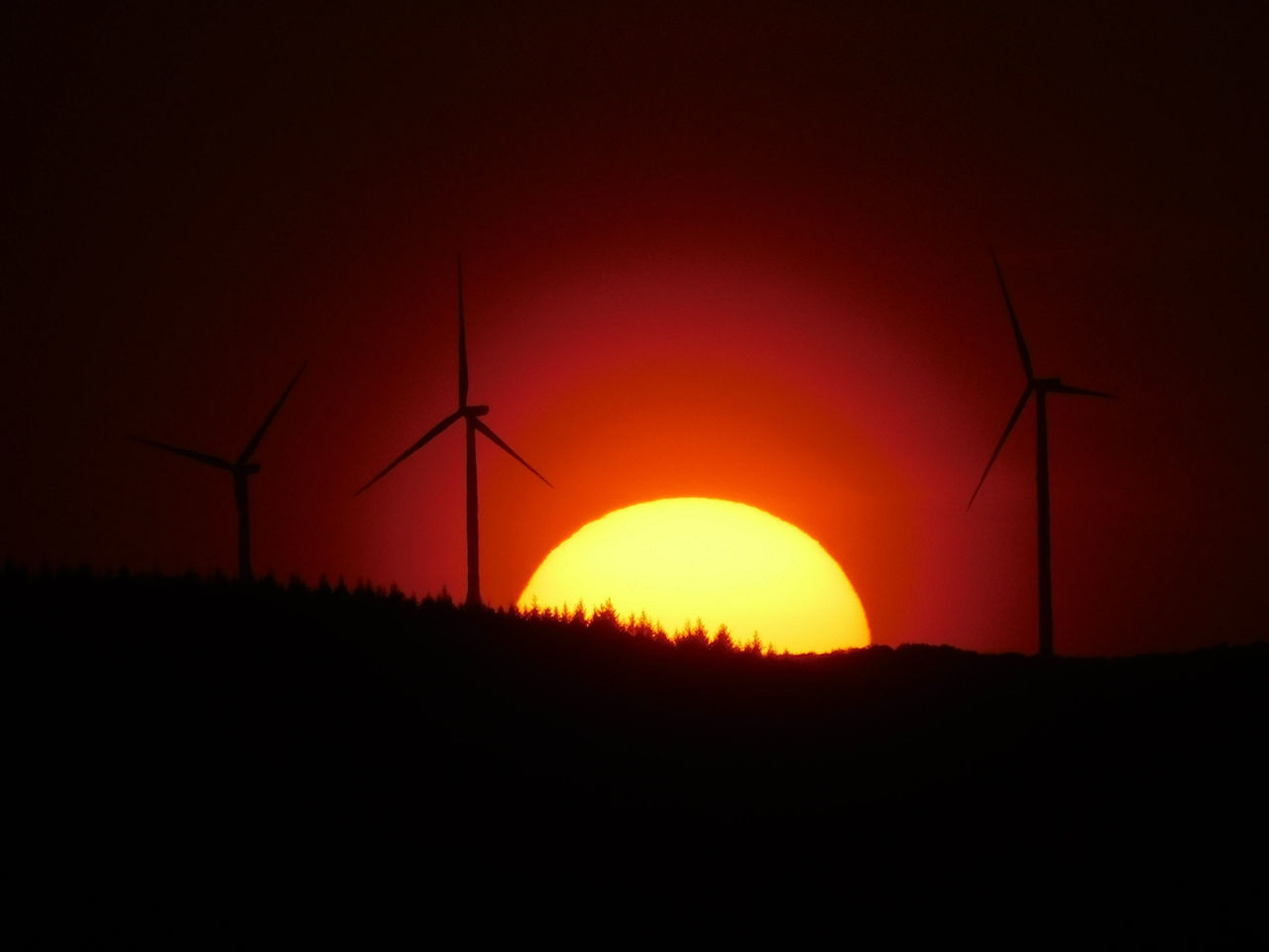 SILHOUETTE WINDMILL ON FIELD AGAINST ORANGE SKY