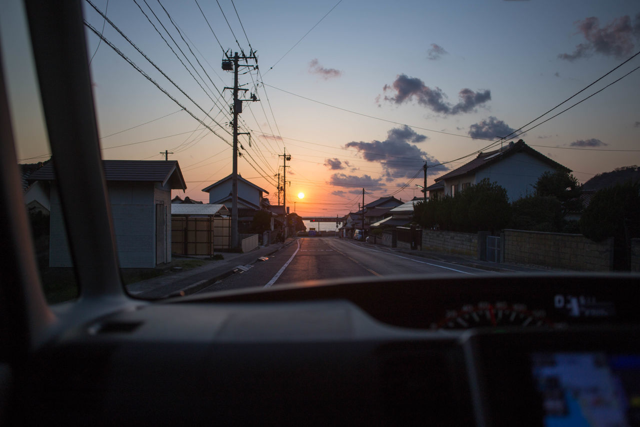 CAR AGAINST SKY DURING SUNSET