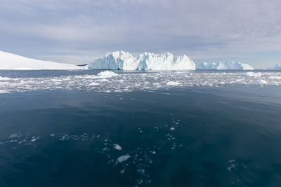 Scenic view of frozen sea against sky