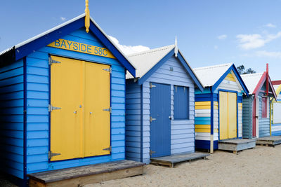 Beach huts against blue sky