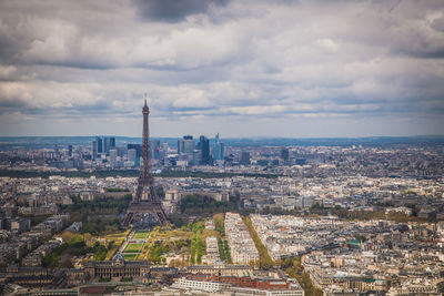 Cityscape against cloudy sky