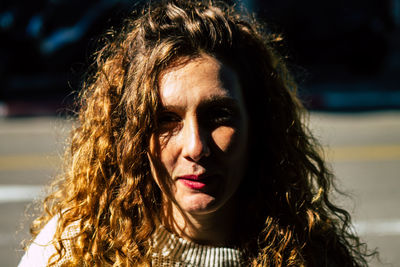 Portrait of beautiful woman against sea