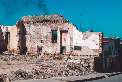 Old buildings against blue sky