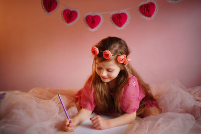 Girl writes a valentine