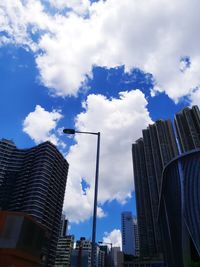 Low angle view of buildings against sky in city
