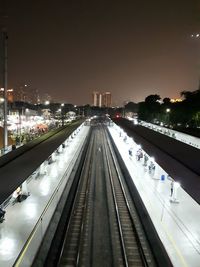 High angle view of railroad tracks at night