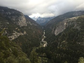 Scenic view of mountains against cloudy sky
