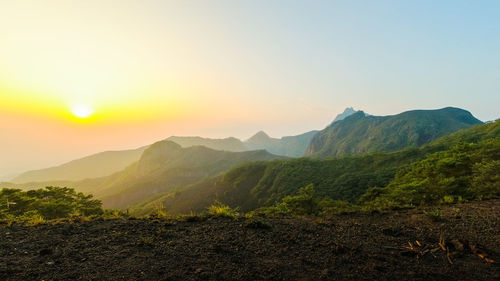 Scenic view of mountains against sky during sunset