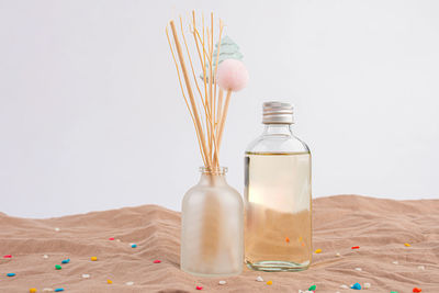 High angle view of bottles on white background