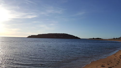 Scenic view of sea against sky at sunset