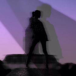 Full length of woman standing in pond