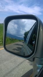 Cropped image of car on road