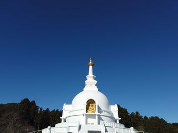 Low angle view of building against clear blue sky