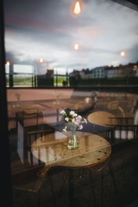 Flower vase on table in restaurant