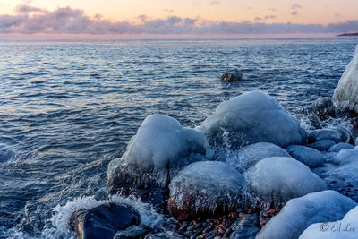 Scenic view of sea against sky during sunset