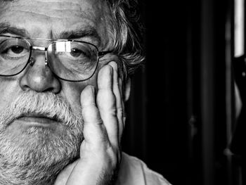 Close-up portrait of man wearing eyeglasses