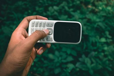 Close-up of person holding mobile phone