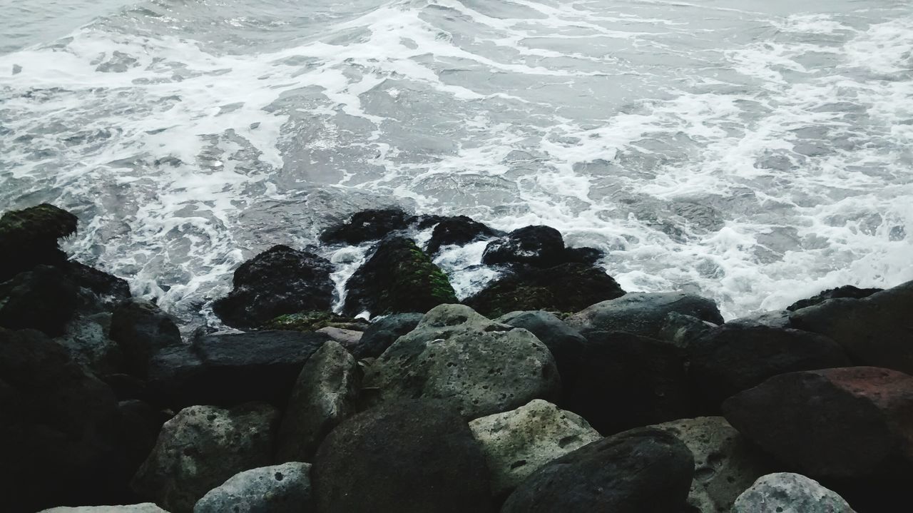 water, sea, rock - object, nature, beauty in nature, tranquility, scenics, surf, high angle view, wave, shore, beach, rock formation, rock, tranquil scene, day, full frame, outdoors, textured, no people