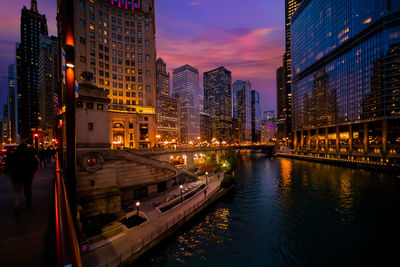 Illuminated buildings in city at night