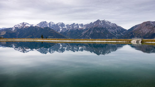 Scenic view of lake and mountains against sky