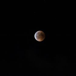 Low angle view of moon against sky at night