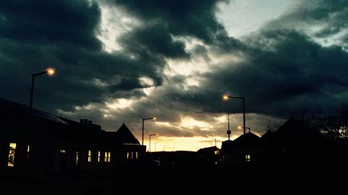 Silhouette built structure against sky at night