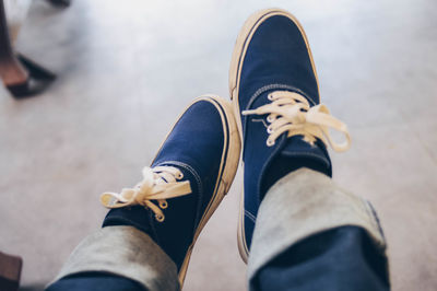 Low section of man wearing shoes outdoors