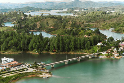 High angle view of scenic view of bridge on lake against mountains