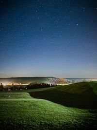 Scenic view of landscape against sky at night