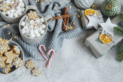 Hot chocolate with marshmallows, warm cozy christmas drink, gingerbread cookies and decorations