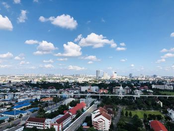 High angle view of buildings, sky and white clouds floating. in thailand