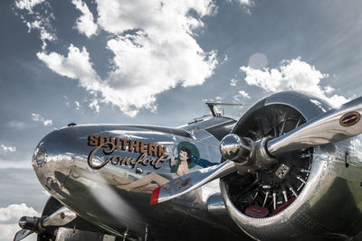 View of old airplane against sky