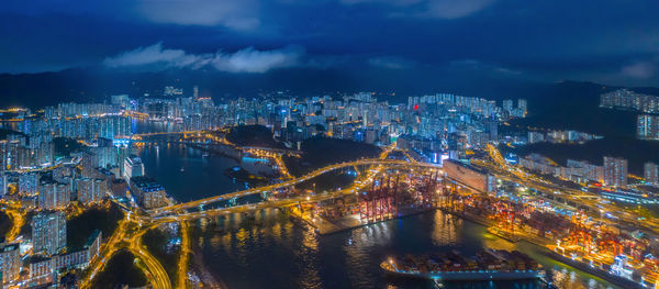 High angle view of illuminated buildings in city at night