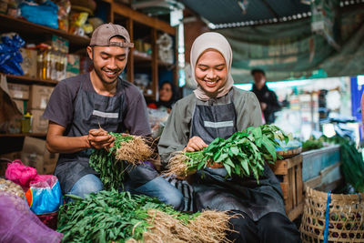 Portrait of smiling man looking at market