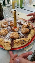 High angle view of hand holding ice cream