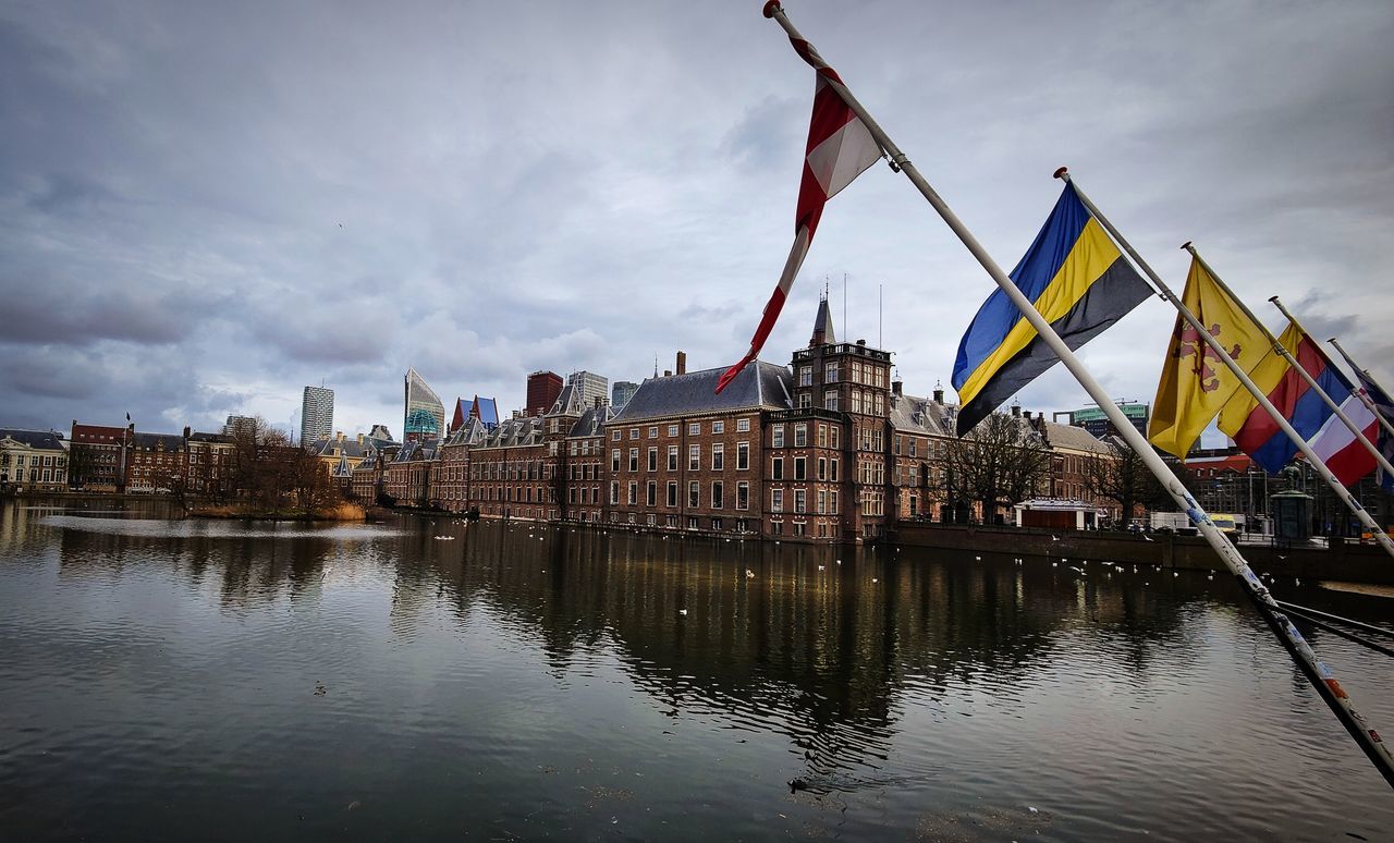 reflection, architecture, water, built structure, flag, sky, building exterior, city, cityscape, cloud, landmark, evening, nature, travel destinations, building, waterway, patriotism, no people, river, urban area, dusk, nautical vessel, outdoors, transportation, travel, ship, skyline, history