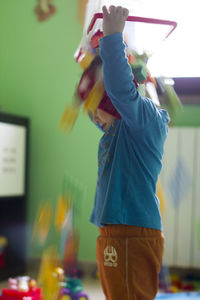 Boy playing with umbrella