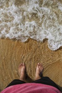 Low section of person on beach