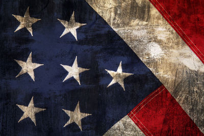 Low angle view of flags against blue sky