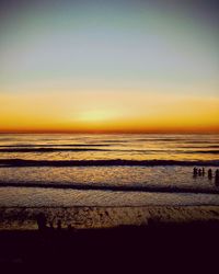 Scenic view of sea against clear sky during sunset